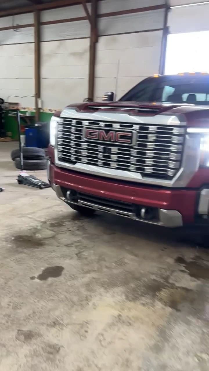 Full-size pickup truck parked in the shop bay