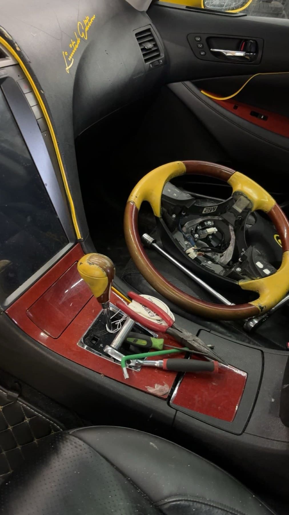 Steering wheel being installed in a car interior